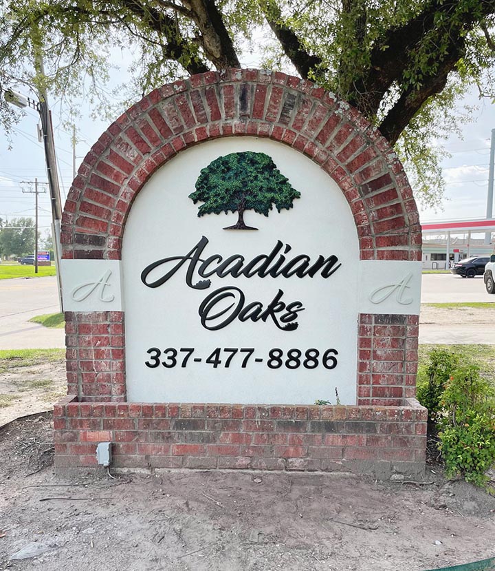 Acadian Oaks - Brick and Stucco - specialty business signs Lake Charles LA 