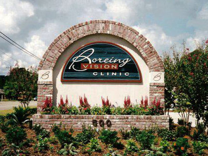 Boreing Vision Clinic Sign - Brick, Stucco, and hand carved redwood sign - Custom monument signs - Lake Charles LA 