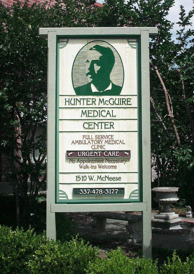 Hunter McGuire wooden sign - sandblasted redwood with cedar post and frame - custom commercial signs - lake charles la - Hebert Signs