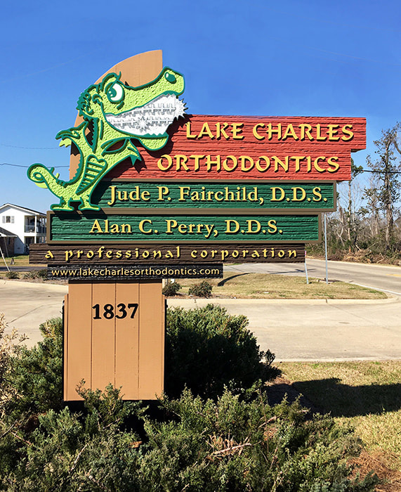 Lake Charles Orthodontics - Custom HDU and hand carved wooden signs - Lake Charles LA 