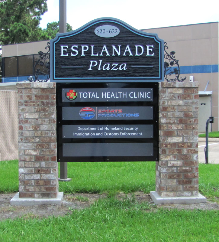 Photo of Esplanade sign - routed HDU, metal tenant sign, mounted on brick and wroght iron - commercial business signs - lake charles la - hebert signs