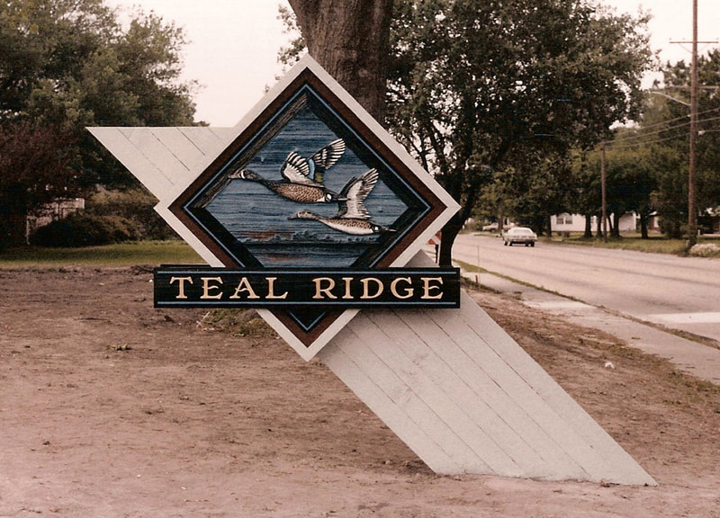 teal ridge, - hand carved - sandblastled - redwood sign with gold letters - custom business signs lake charles la - hebert signs